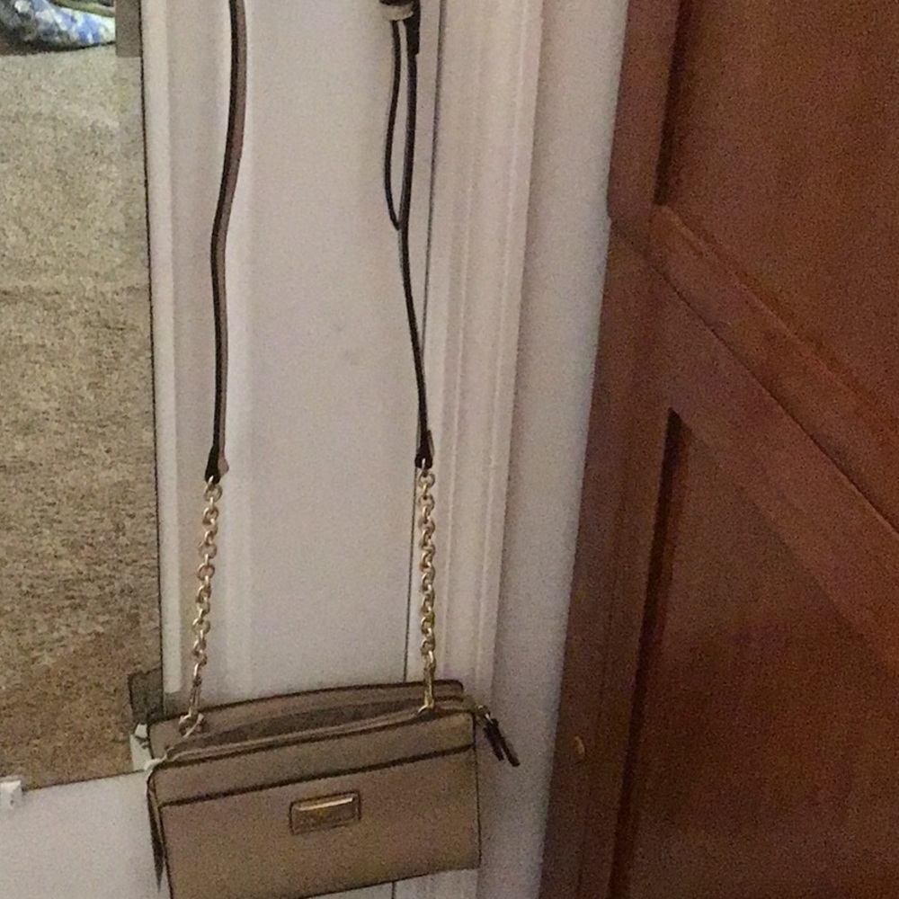 Simply Noelle tan crossbody purse . 
NWT and adjustable strap .